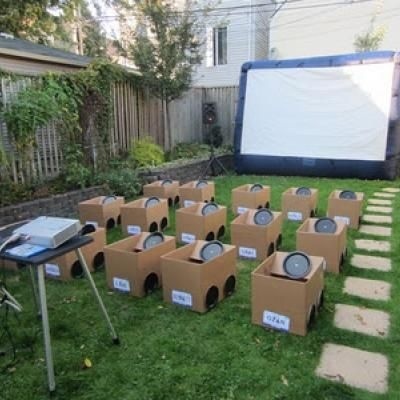 Create an outdoor kids' carnival with cardboard boxes